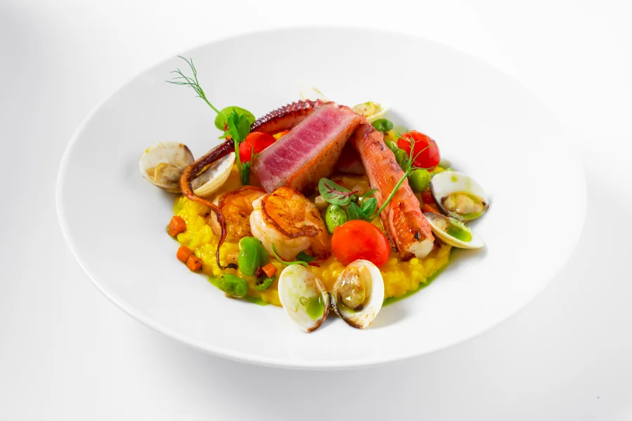 Grilled seafod on the bed of saffron risotto